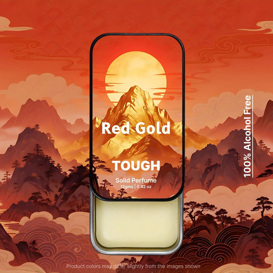 Redgold Tough Solid perfume tin with mountain and sunset design on a red background